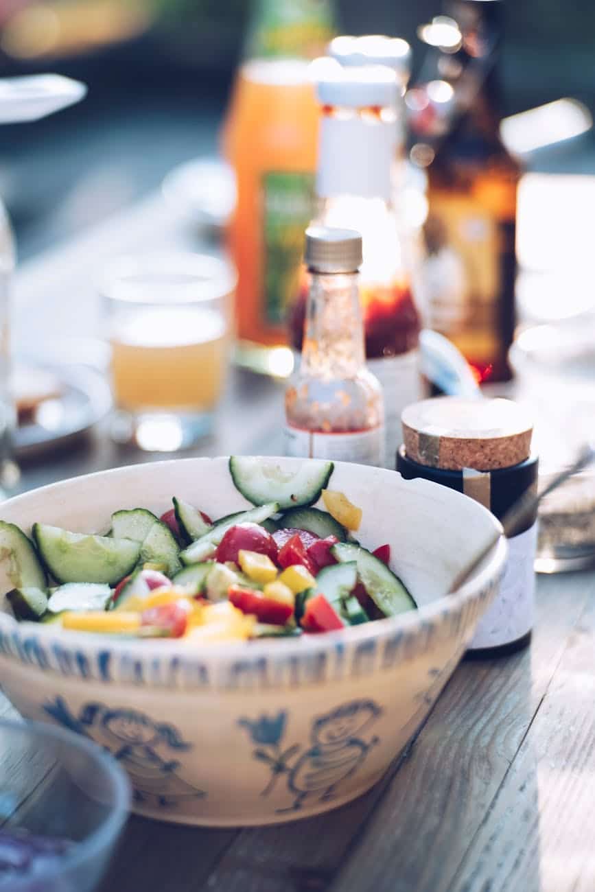 sliced cucumber on white ceramic bowl