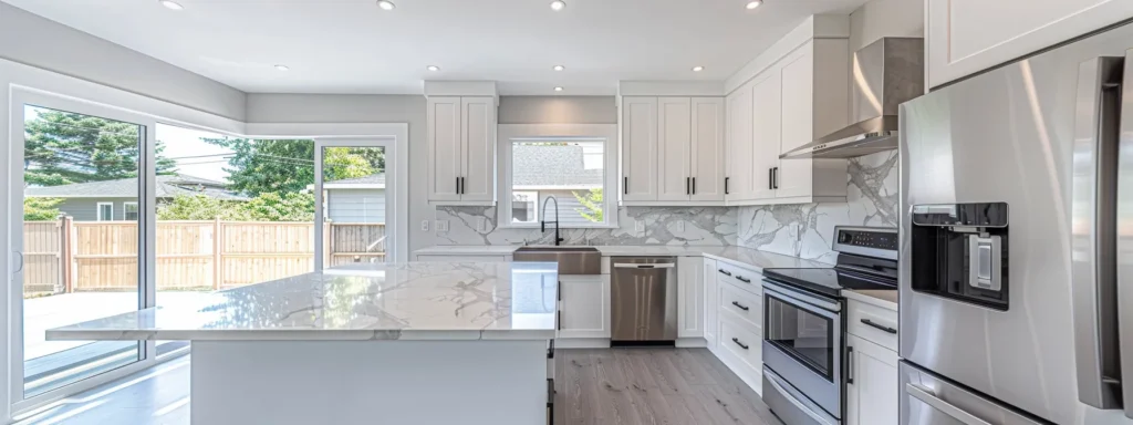 a sleek, minimalist kitchen with white cabinets, uncluttered countertops, and abundant natural light, creating a calm and inviting space for cooking and dining.