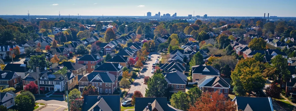 a captivating aerial view of a vibrant raleigh neighborhood showcases roofs of various styles, highlighting their robust materials and fire-resistant features against a backdrop of clear blue skies, symbolizing the city's commitment to safety and durability in building codes.